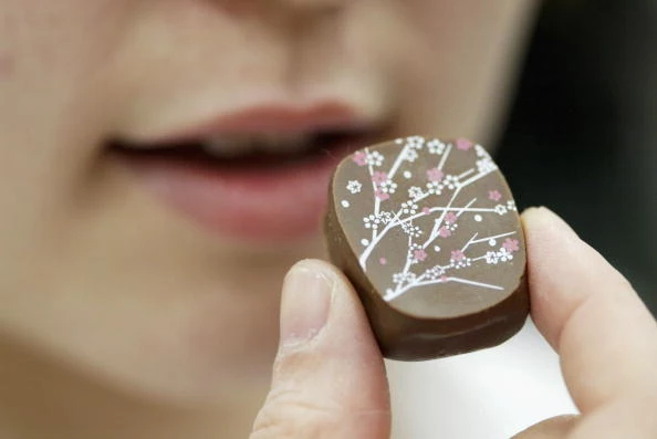 Woman Eating Chocolate Hey, This Chocolate is Good For You!